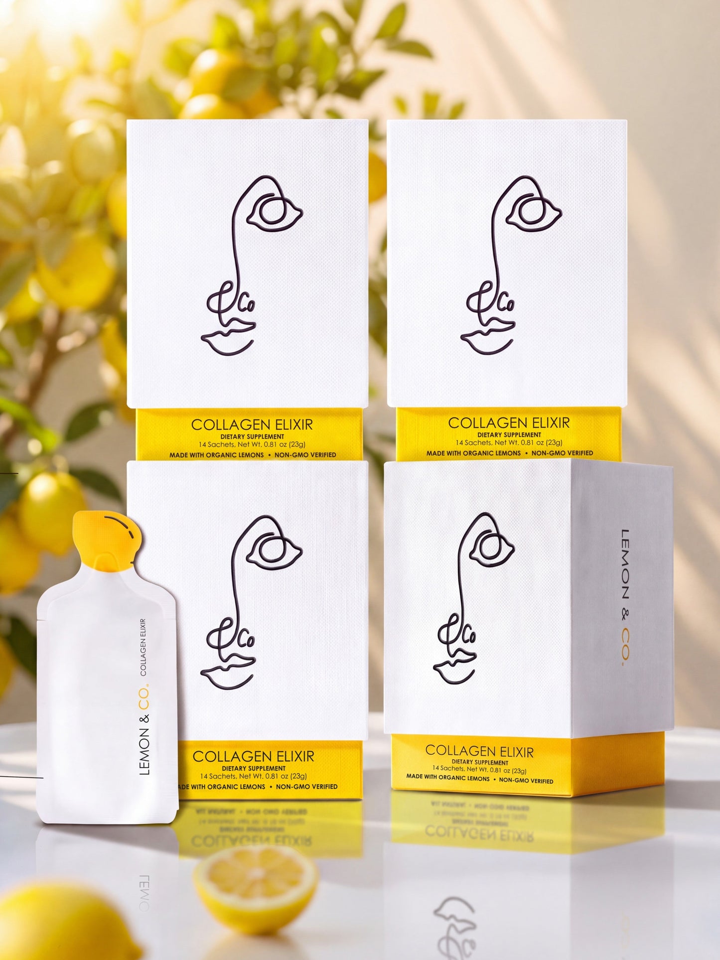Liquid Collagen Elixir 8-Week Bundle: four cartons and a sachet with fresh lemons